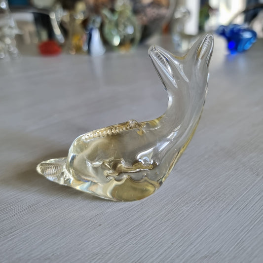 Vintage clear blown glass whale figurine with ridged detailing