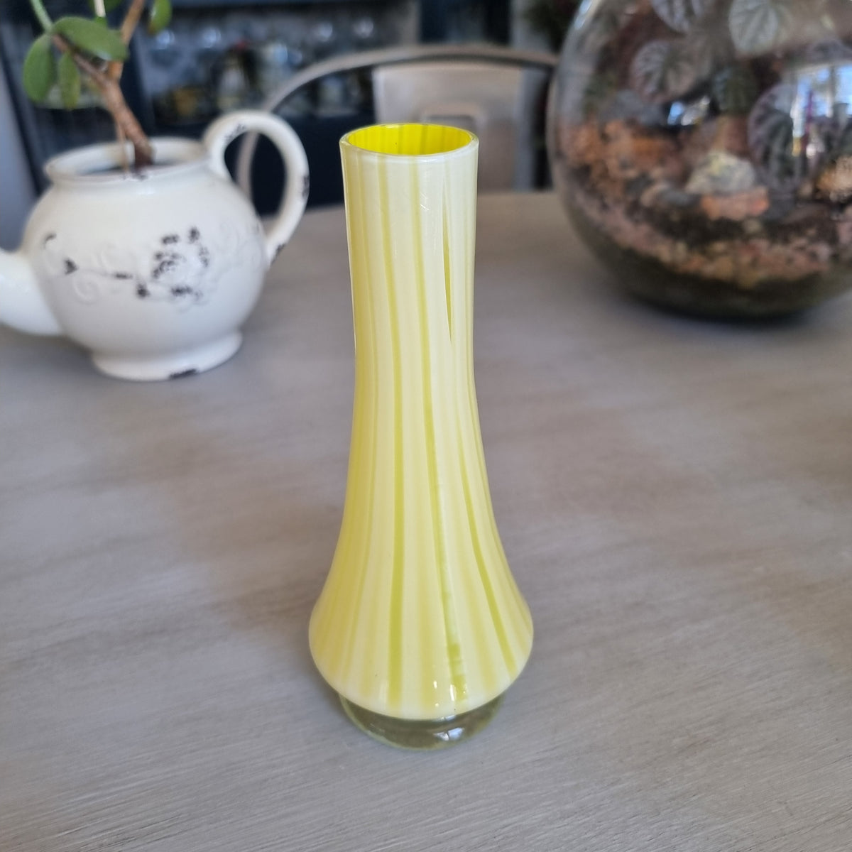 Vintage yellow and white striped glass bud vase with a clear glass foot