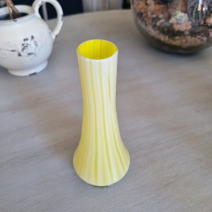Vintage yellow and white striped glass bud vase with a clear glass foot