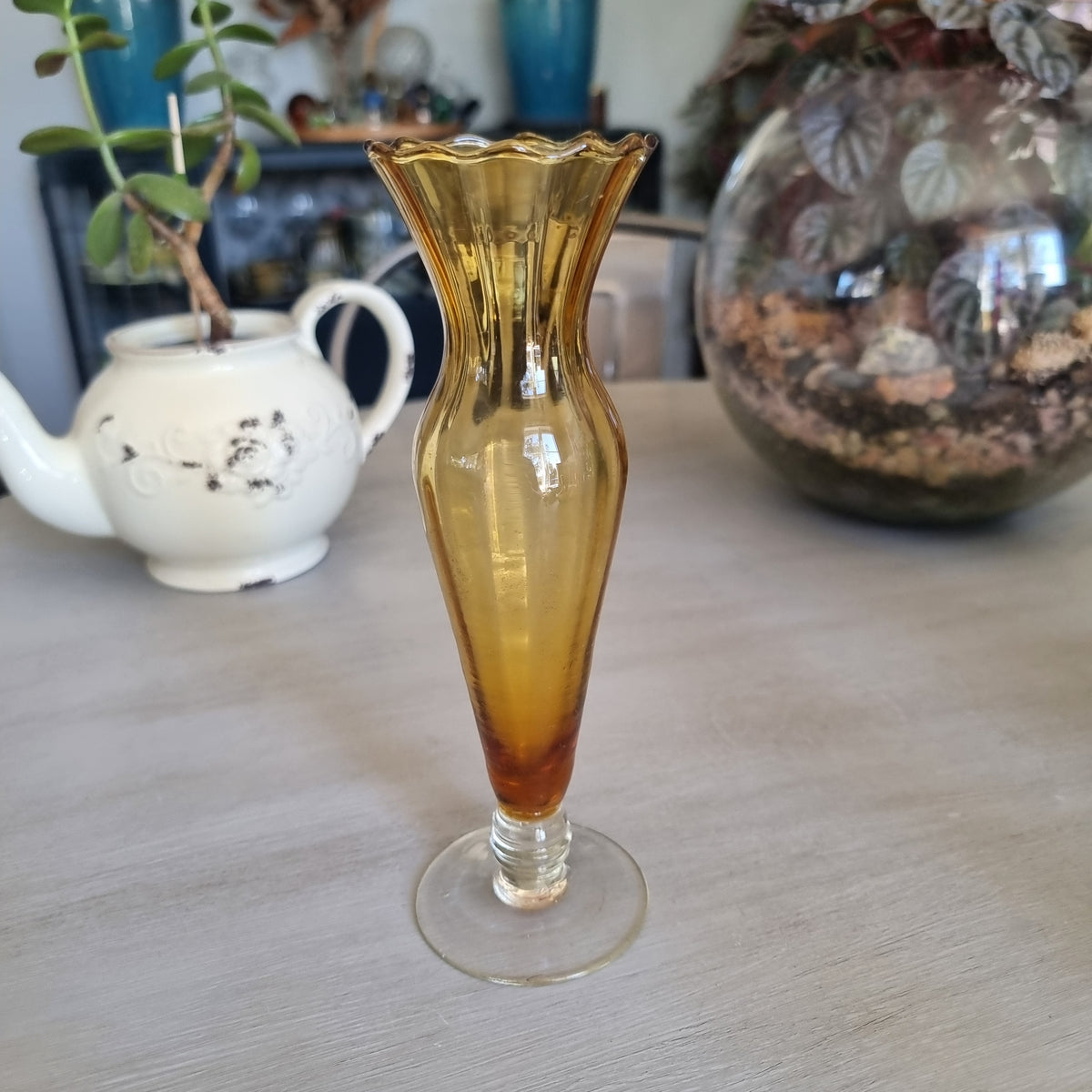 Vintage amber glass bud vase with a scalloped rim, ribbed body and clear glass foot