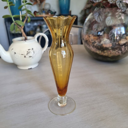 Vintage amber glass bud vase with a scalloped rim, ribbed body and clear glass foot