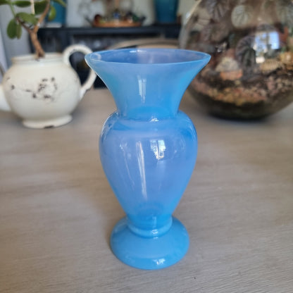 Vintage milky blue glass vase with a rounded body, flared rim and pedestal foot