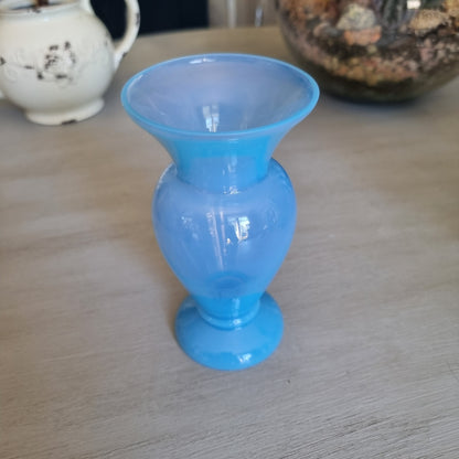 Vintage milky blue glass vase with a rounded body, flared rim and pedestal foot