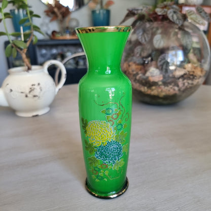Vintage green glass vase with yellow and teal flowers, gold detailing and a gold rim