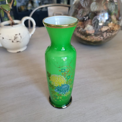 Vintage green glass vase with yellow and teal flowers, gold detailing and a gold rim