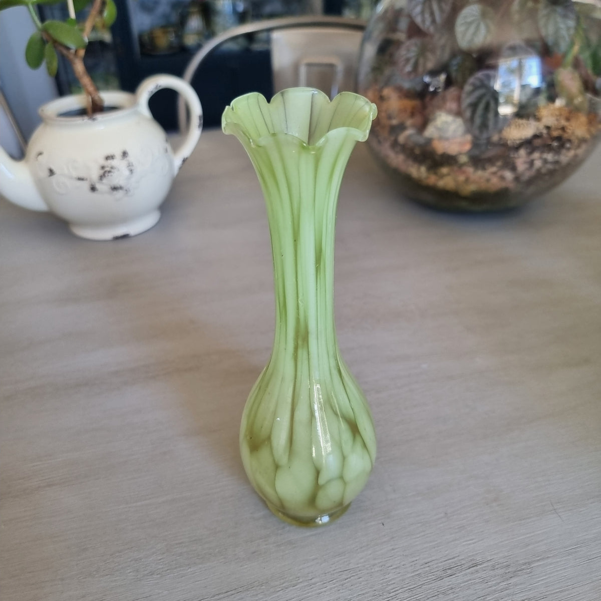 Retro pale green marbled glass vase with a slim neck and ruffled rim