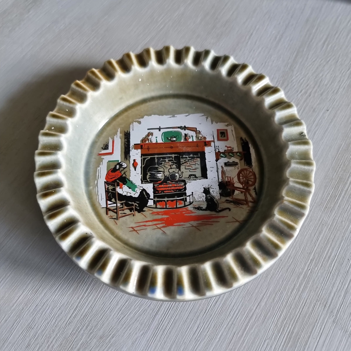 Wade Irish porcelain ashtray with fireside scene, fluted rim and Armagh maker’s mark