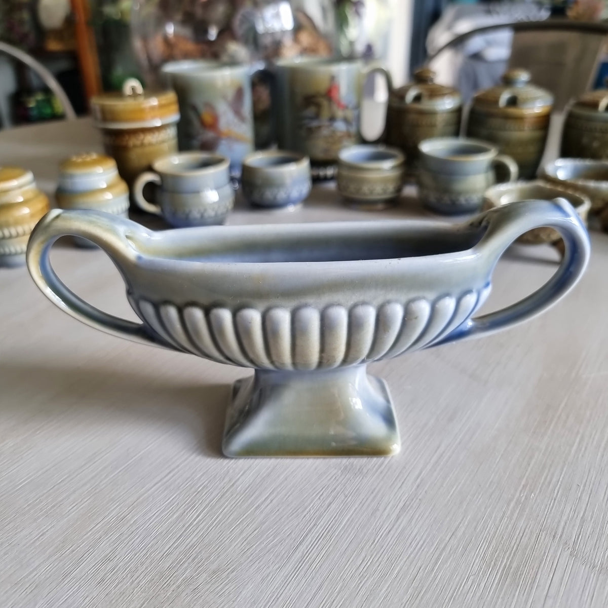 Blue-green Wade Irish porcelain twin-handled posy vase with fluted bowl and pedestal base