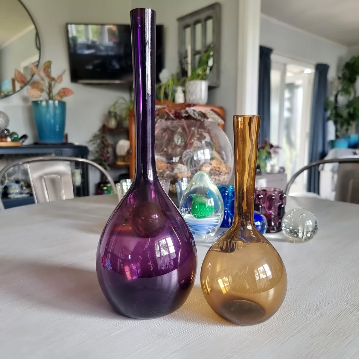 Pair of mid-century Swedish glass bulb vases in purple and amber