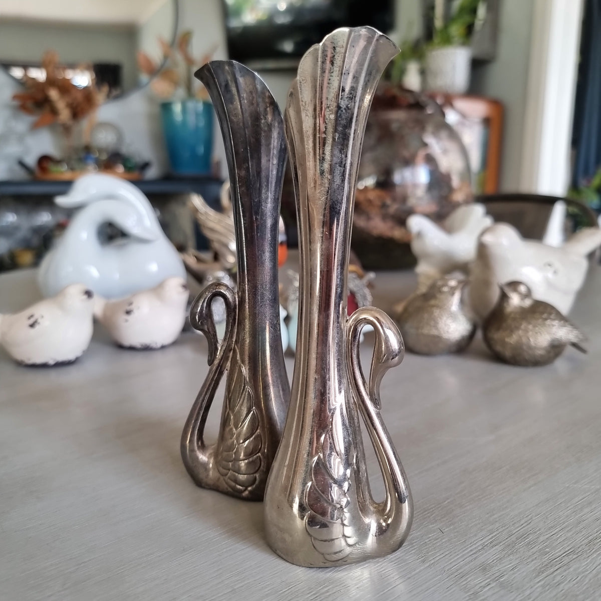 Pair of tall silver plated bud vases with swan handles and fluted tops