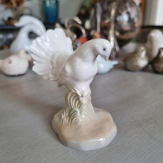 White porcelain dove with fanned tail on a stump base by M. Requena, Valencia Spain