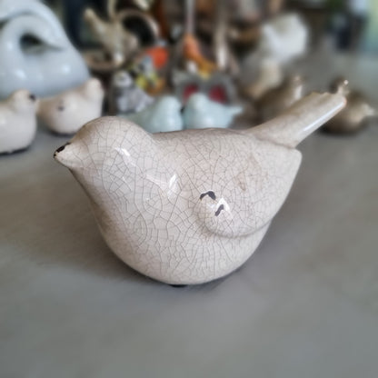 Cream crackle glaze ceramic bird with brown distressed touches