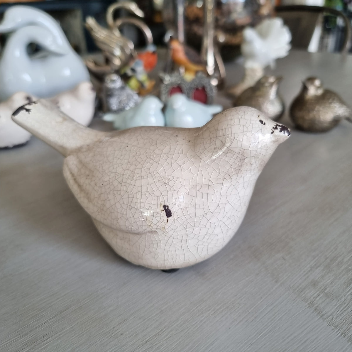 Cream crackle glaze ceramic bird with brown distressed touches
