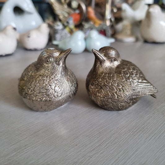 Pair of silver bird salt and pepper shakers with engraved feather detail