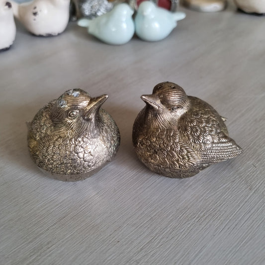 Pair of silver bird salt and pepper shakers with engraved feather detail